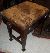 A circa 1900 leather upholstered adjustable piano stool with patent action CONDITION