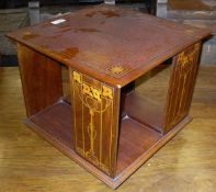An early 20th Century mahogany and inlaid table top library bookcase in the Art Nouveau taste
