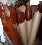 A box containing seven packets of brown calf leather