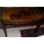 A TV table in the manner of Gordon Russell, a mahogany red leather topped coffee table,