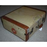 A White Star luggage leather and woven suitcase bearing labels to the exterior and label to the