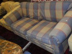 A modern yellow ground floral upholstered two seat sofa,