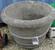 A large composite stone circular planter