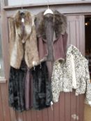Four faux fur coats, together with a box containing assorted fur hats, stoles,