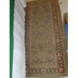 A cream ground Persian rug,