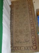 A cream ground Persian rug,
