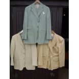 A green Pakeman CatTo & Carter linen suit together with a yellow linen jacket and a David Burnett