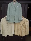 A green Pakeman CatTo & Carter linen suit together with a yellow linen jacket and a David Burnett