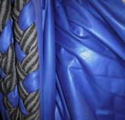 A pair of glazed cotton lined curtains of blue ground with striped black and brown edging and