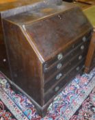 An early 19th Century mahogany and satinwood bureau,