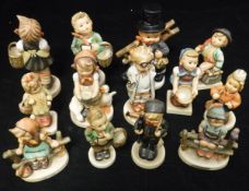 A collection of Goebel Hummel figures including: "Village Boy", "I brought you a gift",