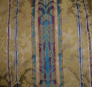 Two pairs of interlined curtains with damask style decoration on a striped gold,