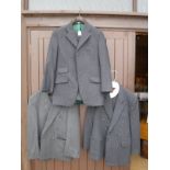 A collection of four suits each bearing tailors labels, to include Sams Taylors,
