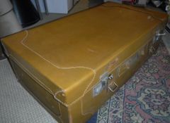 A vintage leather suitcase with lined interior