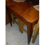 A modern cherry wood farmhouse style kitchen table in the French taste,
