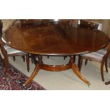 In the manner of Brights of Nettlebed mahogany circular table on four turned columnar supports,