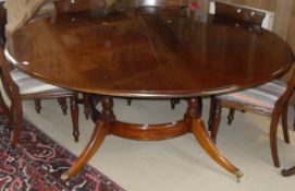 In the manner of Brights of Nettlebed mahogany circular table on four turned columnar supports,