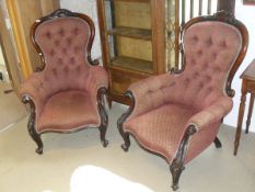 A pair of Victorian walnut framed salon chairs,