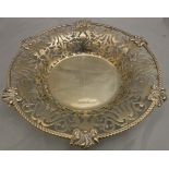 A George V silver sweet meat dish with pierced foliate and floral decoration and gadrooned rim,