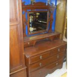 A late Victorian mahogany single mirror door wardrobe and matching dressing chest