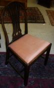 A set of four 19th Century hoop backed mahogany dining chairs with pierced splat backs in the