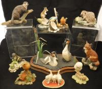 A collection of Border Fine Arts figures including "Robin", "Fox", "Owl and Mouse",