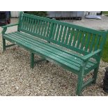 A green painted garden bench