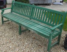 A green painted garden bench