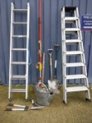 An aluminium extending ladder, aluminium folding stepladder and assorted long-handled tools,