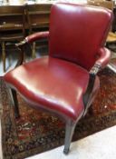 A 20th Century mahogany framed red leather upholstered armchair