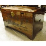 An Eastern hardwood trunk with relief carved decoration,