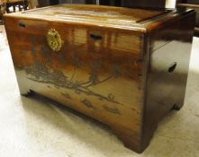 An Eastern hardwood trunk with relief carved decoration,