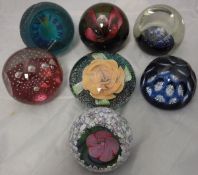 A collection of seven Caithness Royal Commemorative paperweights including "Her Majesty the Queen's