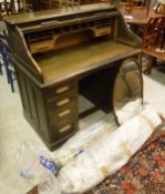 A 20th Century oak tambour fronted desk,