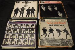 A collection of records The Beatles "Sgt Pepper's Lonely Hearts Club Band",