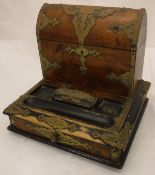 A Victorian walnut and brass bound desk top stationery cabinet in the gothic rervival taste by