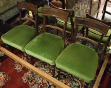 A set of six mahogany bar back Regency dining chairs with green upholstered plush seats on turned