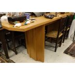 A 20th Century oak buffet serving table raised on twin pedestal supports together with a small