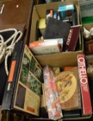 Two boxes of assorted games to include Scrabble, jigsaw puzzles,