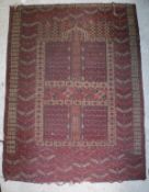 A Persian rug, the red ground with decoration in black, cream and blue,