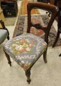 A set of six Victorian mahogany balloon back dining chairs with floral upholstered seats,