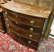 A 19th Century mahogany bow front chest of four long graduated drawers with brass drop ring handles