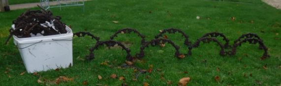 A selection of iron garden boarder/path edging hoops decorated with berry on vine