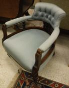 A walnut framed Victorian salon chair with pale blue upholstery