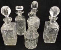 A collection of various glass ware to includec five decanters, a collection of various stoppers,