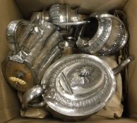 A box containing a three piece Victorian plated tea set with associated hot water jug, etc,