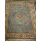 A modern Chinese superwash rug, the central medallion on a silver and grey ground,