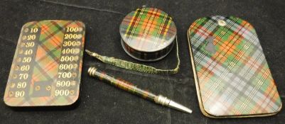 A 19th Century Tartan ware tape measure in Macbeth tartan, inscribed "Macbeth",