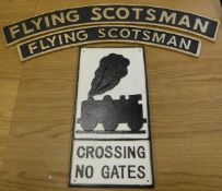 A collection of four various cast metal signs including "Antiques",