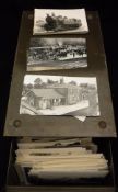A tin containing various postcards and reproduction images of trains, train stations,